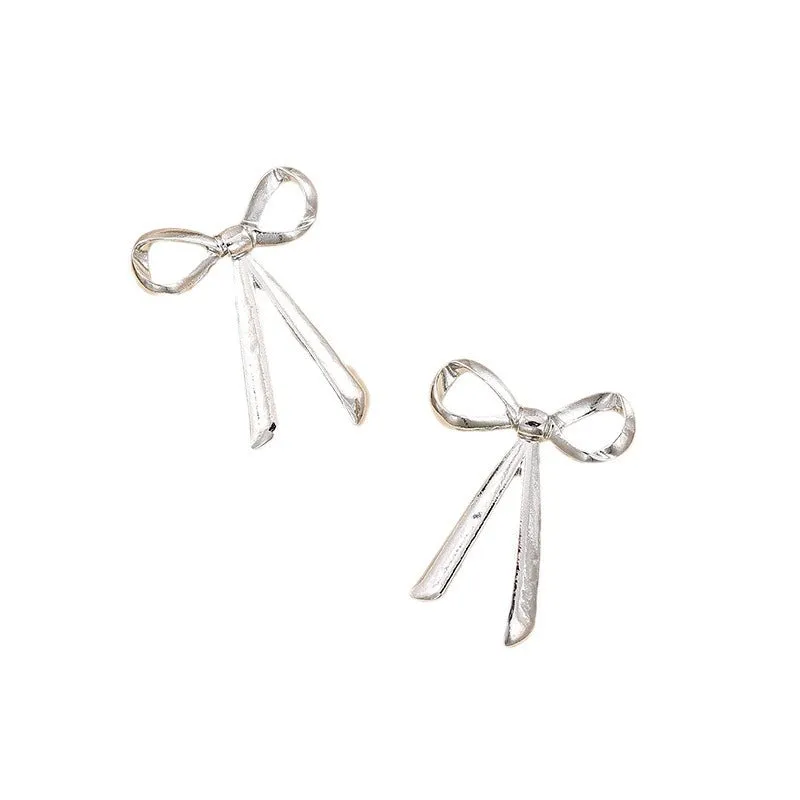 Exaggerated Metal Ribbon Knot Earrings with a Touch of Vienna Glam